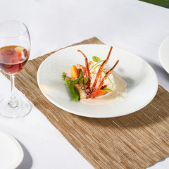 Beautiful and tasty food on a plate, exquisite dish, creative restaurant meal concept.