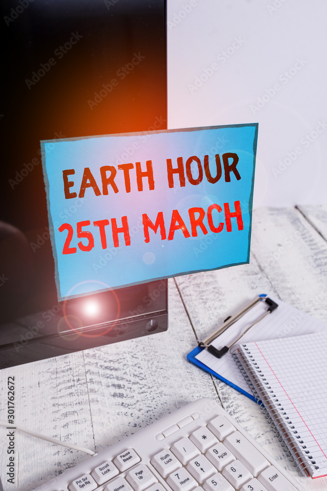 Aufkleber writing note showing earth hour 25th march. business concept for symbol commitment to planet organiz