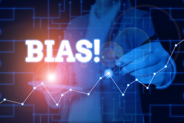 Conceptual hand writing showing Bias. Concept meaning inclination or prejudice for or against one demonstrating group Woman wear formal work suit present using smart latest device