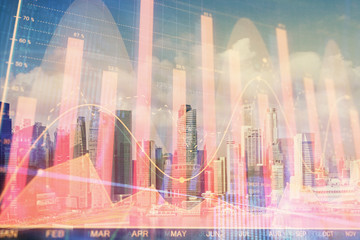 Forex chart on cityscape with skyscrapers wallpaper multi exposure. Financial research concept.