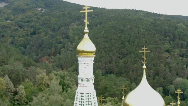 Magnificent  Russian memorial church spire golden crosses and domes. close view