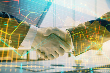 Multi exposure of financial graph on office background with two businessmen handshake. Concept of success in business