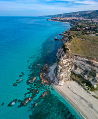 Aerial view of promontory of the Calabrian coast overlooking the sea, town of Riaci, Tropea, Calabria, Italy. Beaches and crystal clear sea. Paths that run along headlands to admire the coast