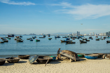 Da Nang / Vietnam - July 2019: "thung chai" boats at my khe beach, Da Nang Vietnam.