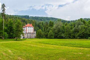 Fototapeta na wymiar Snežnik Castle is a 13th-century castle in the Lož Valley near the settlement of Kozarišče in the municipality of Loška in Slovenia