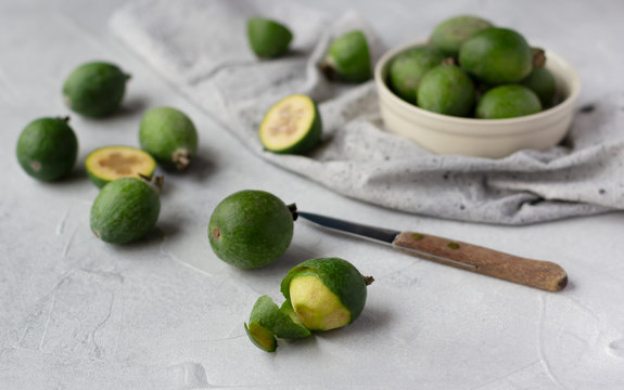 Feijoa fruit on grey background, or pineapple guava healthy tropical fruit