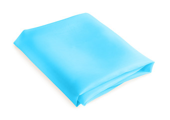 folded piece of light blue fabric isolated on white background