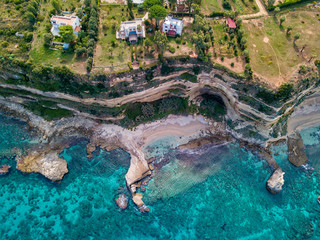 Aerial view of the Calabrian coast, cliffs overlooking the crystal clear sea and luxury villas. Locality of Riaci south of Tropea. Calabria. Italy