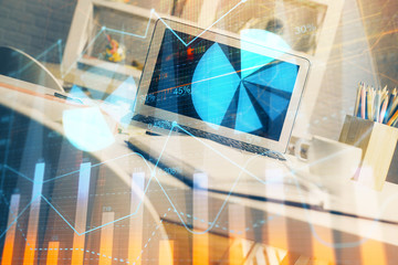 Fototapeta na wymiar Forex market chart hologram and personal computer background. Multi exposure. Concept of investment.