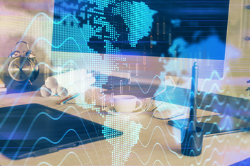 Forex market chart hologram and personal computer background. Multi exposure. Concept of investment.
