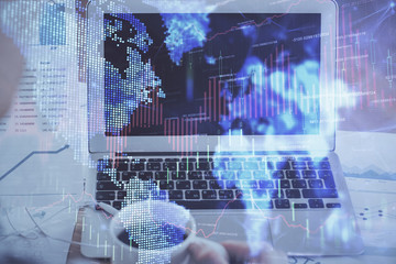 Stock market graph and table with computer background. Multi exposure. Concept of financial analysis.