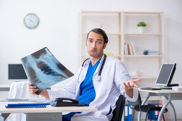 Young male doctor working in the clinic