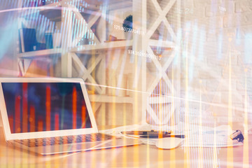 Forex market chart hologram and personal computer background. Multi exposure. Concept of investment.