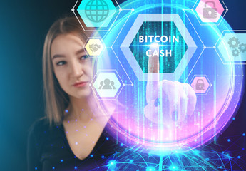 Business, Technology, Internet and network concept. Young businessman working on a virtual screen of the future and sees the inscription: Bitcoin cash