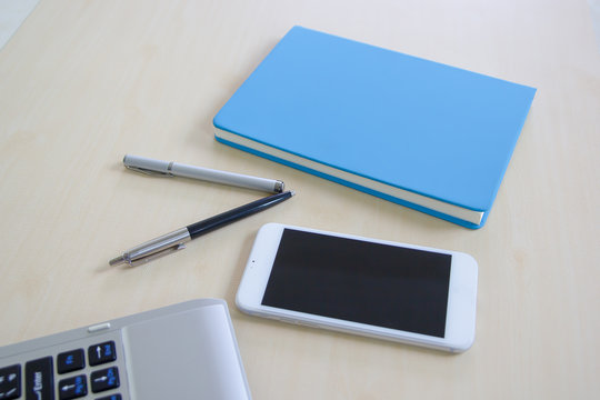 Notebook and mobile on tabale