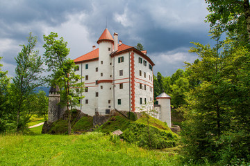 Fototapeta na wymiar Snežnik Castle is a 13th-century castle in the Lož Valley near the settlement of Kozarišče in the municipality of Loška in Slovenia