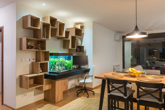 Interior of a open plan apartment with wooden shelf
