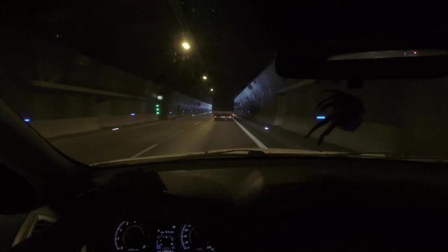 View from the car cabin in motion in the tunnel.