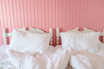 Fototapeta na wymiar Loft style bedroom pink color wall