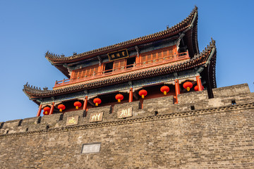Traditional facade of buildings, exterior of buildings,loated Jingzhou China.Close-up of historic buildings.There china letters on building is"Jingzhou gate" builded in the Three Kingdoms Period.