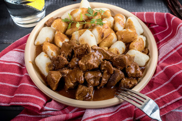 Beef stew with potatoes dumplings.