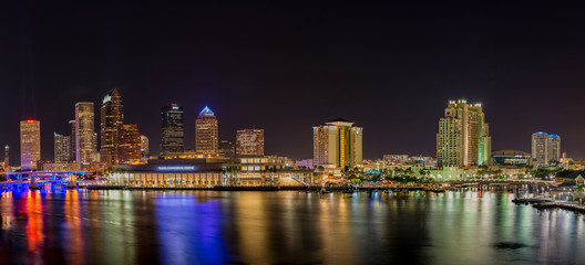 Downtown Tampa skyline with Tampa Bay in the foreground, photographed at night.