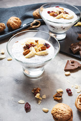 Chia pudding parfait puff with banana, yogurt and nuts