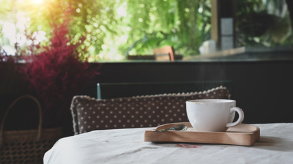 Coffee morning concept, Cup of coffee with hot drink on cafe table.