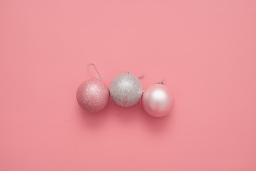 Pink background with pink balls. Christmas flay lay. Top view