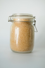 Brown or cane sugar in glass jar