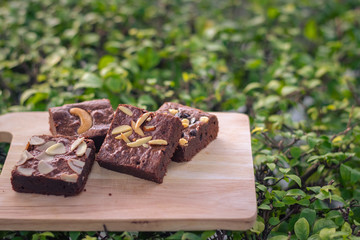Fudge brownies on wooden plate