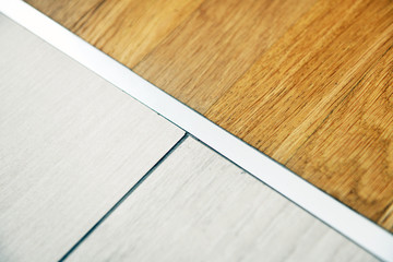 aluminum threshold between ceramic tiles and parquet	