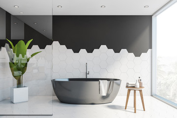 Black and white tile bathroom interior, tub