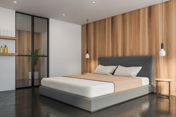 White and wooden master bedroom corner