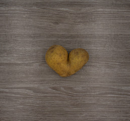 Potato heart on a wooden table