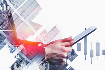 Man using tablet in city, forex chart