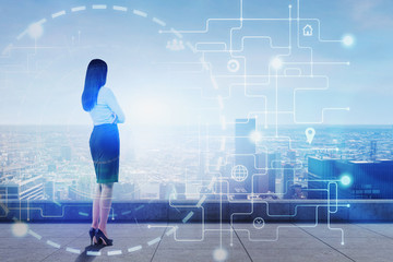 Woman looking at city with big data interface