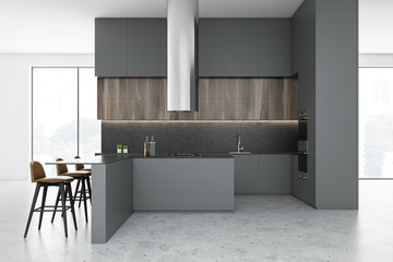 Side view of gray and white kitchen with bar
