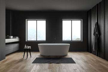 Interior of gray and dark wooden bathroom