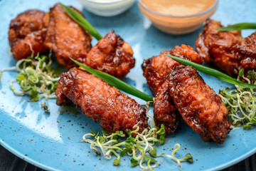 Baked chicken wings in the Asian style on plate
