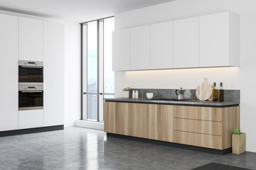 White kitchen corner with wooden counters
