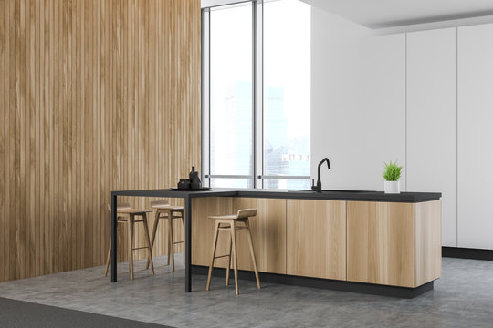 Spacious white kitchen corner with wooden bar