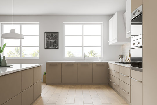 Side view of white and beige kitchen with picture