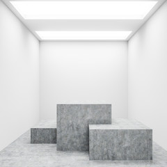 Interior of white room with three concrete shelves