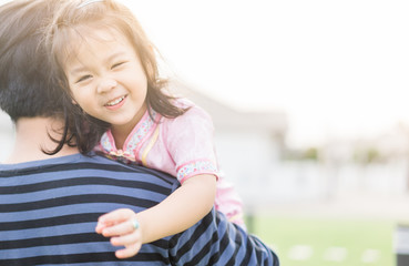 Bonding time! Father and his daughter are playing at home.Cute little asian girl play with her dad.Family holiday and togetherness.