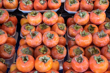 Organic persimmon at fruit market
