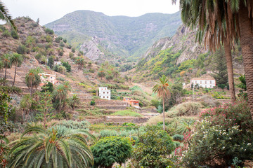 Typical La Gomera Island landscape with mountain and green palm trees, is World Biosphere Reserve...