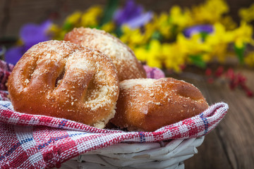 Buns with berries on a wooden table.