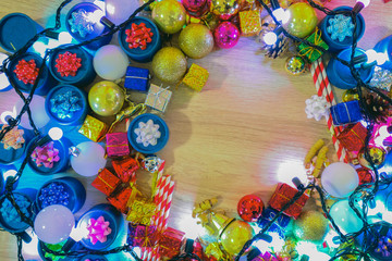 Fototapeta na wymiar Christmas background, Merry Christmas greeting card idea colorful gifts and sparkle light bulb