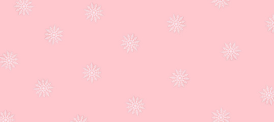 Winter pattern made of snowflakes and on pink background. Christmas concept. Flat lay.